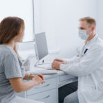 doctor protective mask receives patient his office prevention diseases pandemic